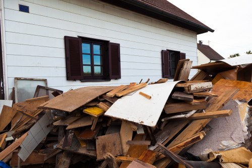 Satisfied clients with clean construction site after waste clearance